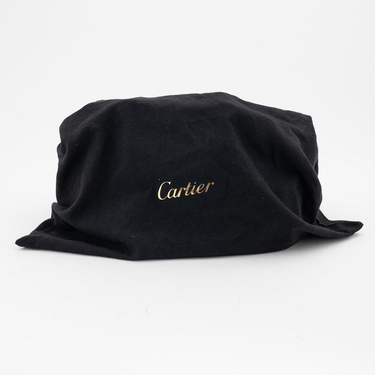 Cartier, a black leather handbag.