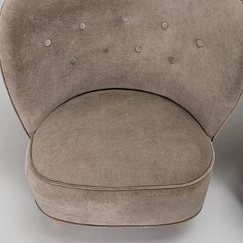 A pair of mid 20th century armchairs.