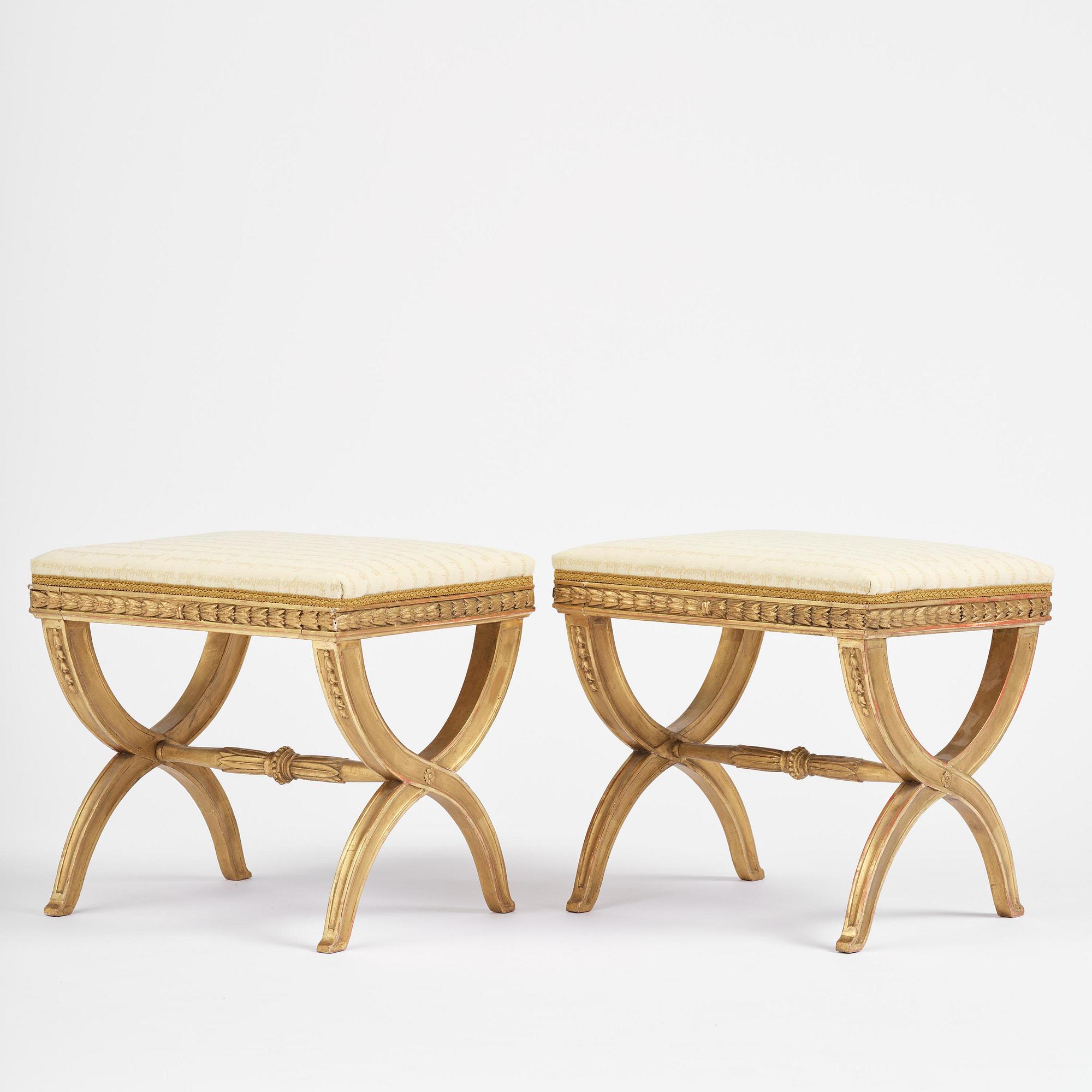 A pair of late Gustavian giltwood stools, Stockholm, late 18th century.