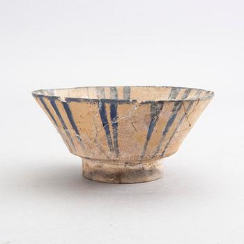 A 13th century Persian earthenware bowl, height 7 cm.