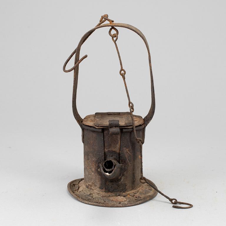 A 19th century tinplate oil lamp.