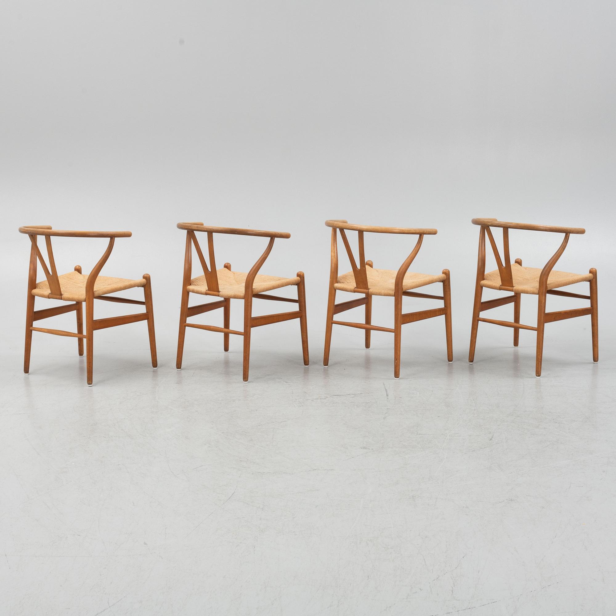 Hans J Wegner, a set of four model CH-24 ”Wishbone” chairs, Carl Hansen & Son, Odense, Denmark.