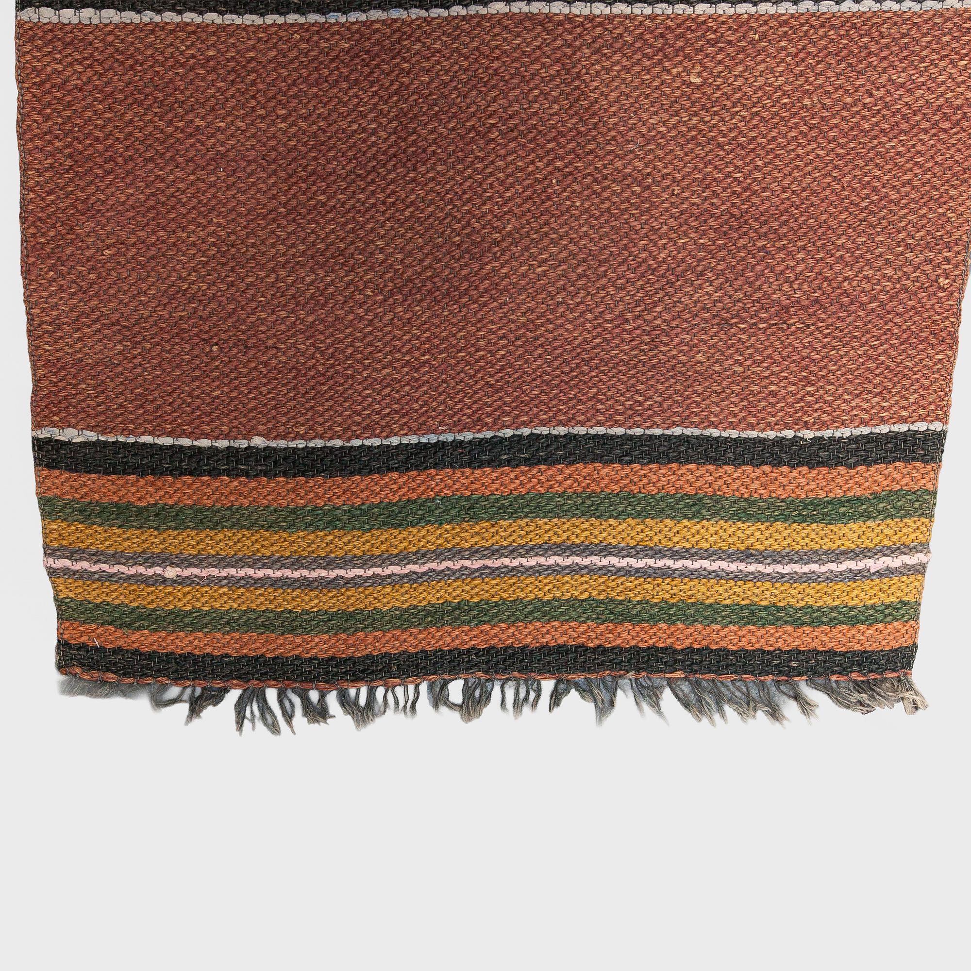 A 1930/1940s rag rug /runner. Circa 550 x 74 cm.