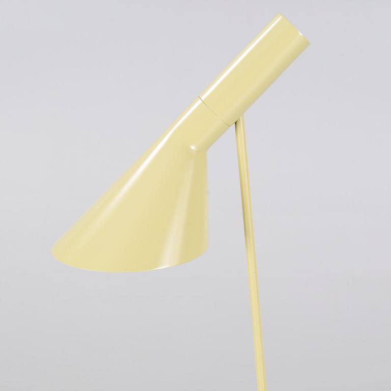 An "AJ" floor lamp, designed by Arne Jacobsen for Louis Poulsen, 21st century.