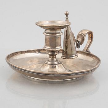 A silver chamber candlestick with mark of R & S Garrard & Co, London, England 1848.