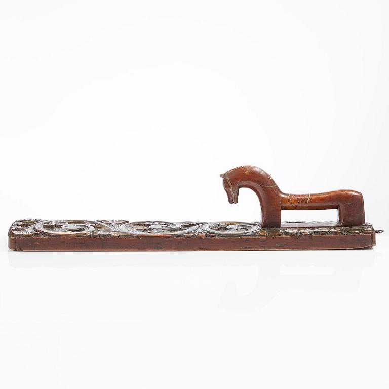 A carved and polychrome painted mangle board, Sweden, late 18th / early 19th century.