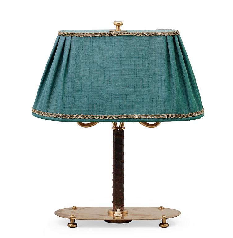 A Josef Frank brass and brown leather table lamp, model nr 2388, Svenskt Tenn 1940-50's.