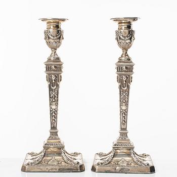 A pair of English silver candlesticks, mark of William Hutton & Sons Ltd, London 1902.