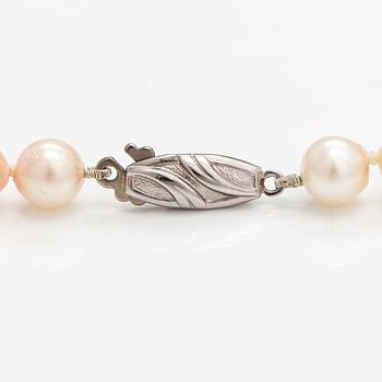 A pearl collier and two-strand pearl bracelet with cultured pearls and sterling silver.