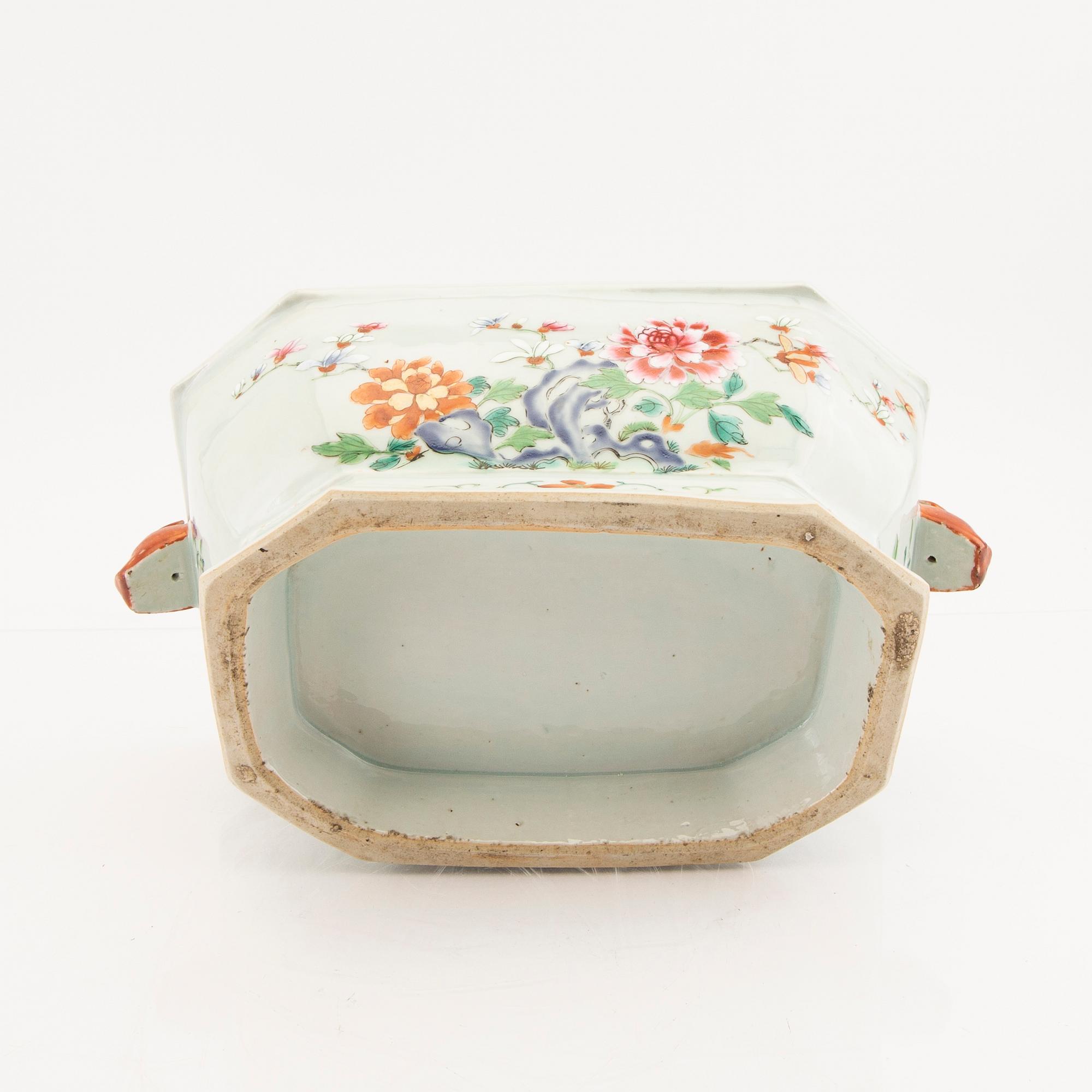 A Chinese famille rose tureen with cover and plate later part of the 18th century.