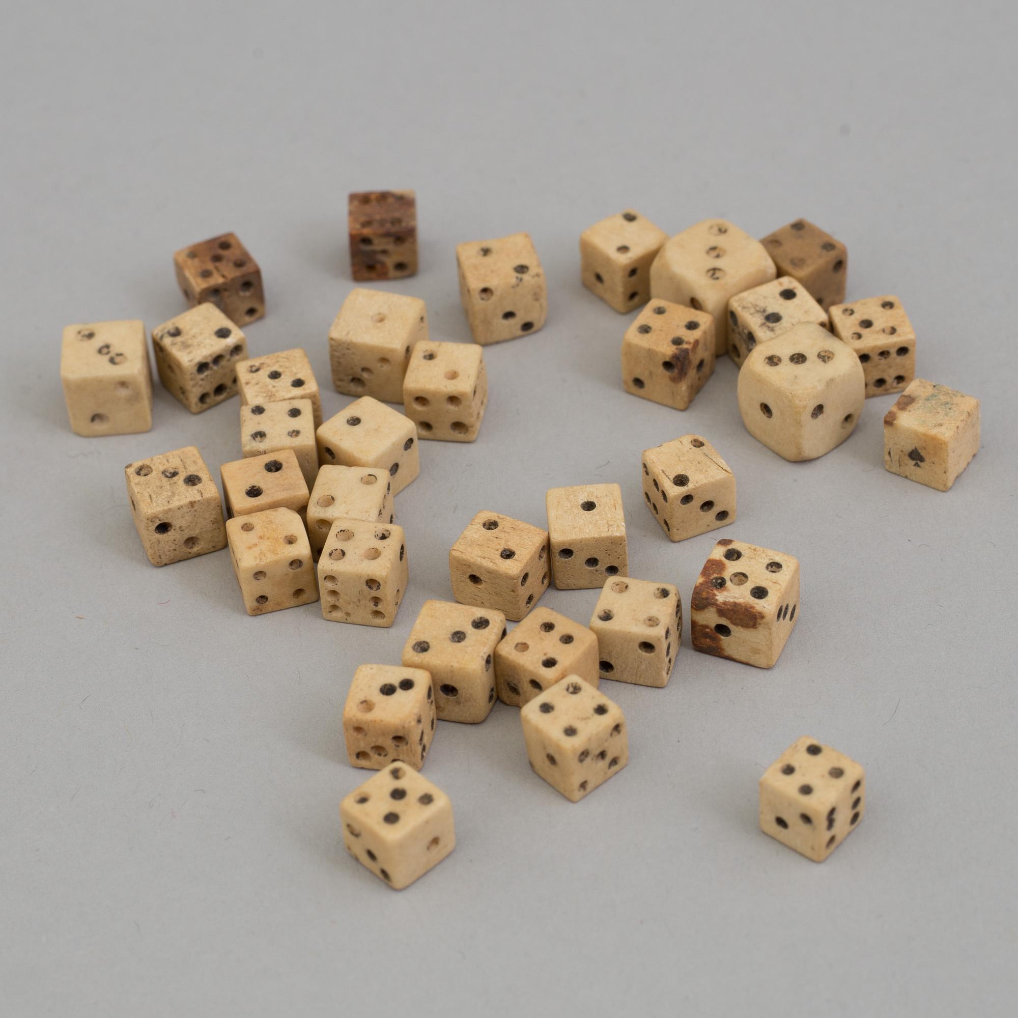 A COLLECTION OF 34 BONE MINIATURE DICE, 19th century.