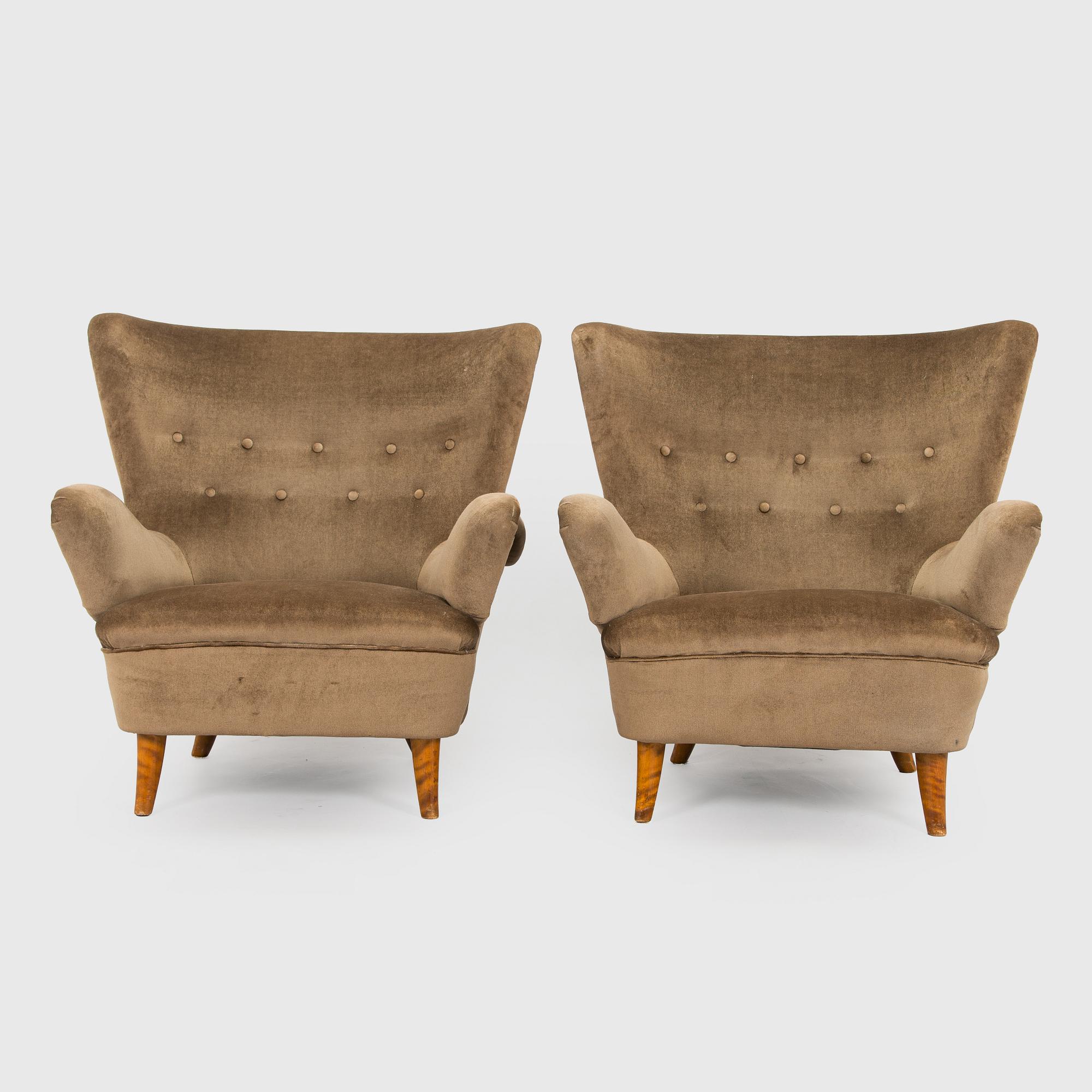 A pair of mid-20th century armchairs.