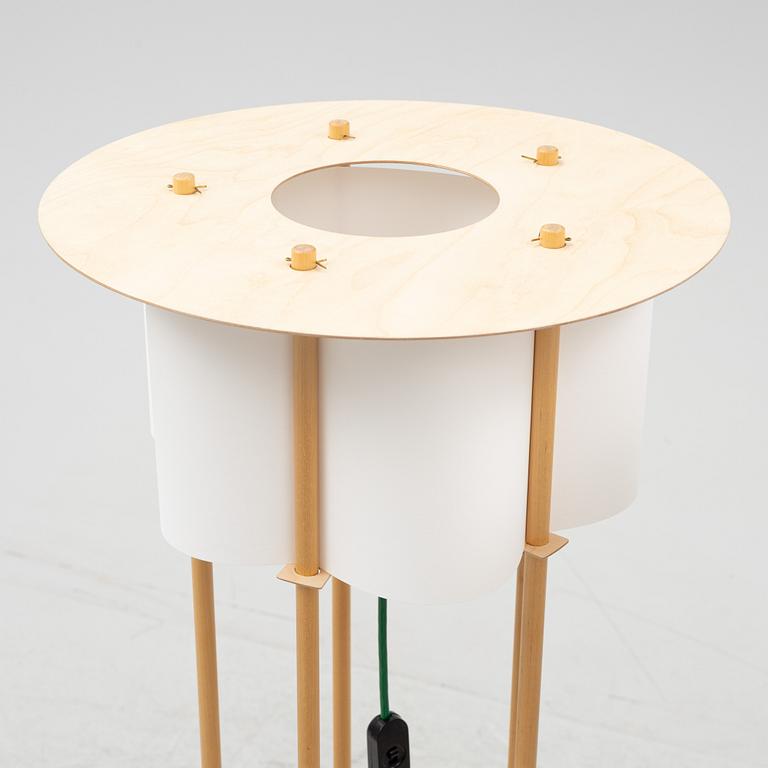 Torbjörn Ahlström, a pair of birch floor lights, dated 1993.