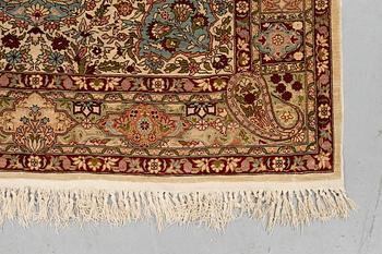 A rug, Old silk Hereke, ca 152 x 110 cm.