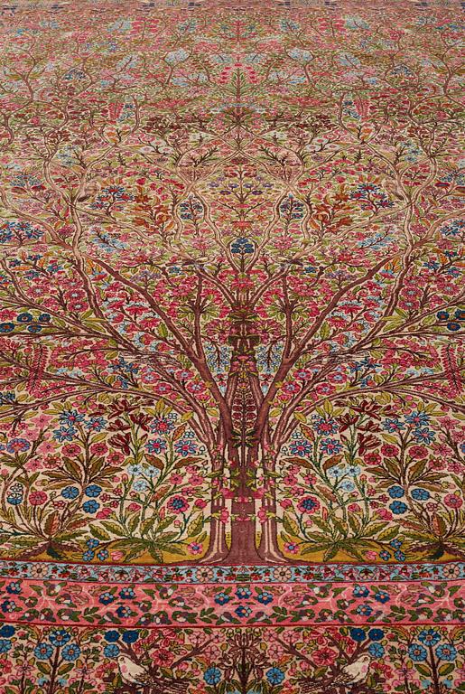 A CARPET, a semi-antique Kerman, ca 479 x 317 cm.