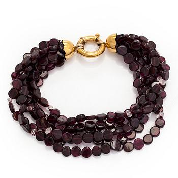 An 18K gold bracelets with garnets.