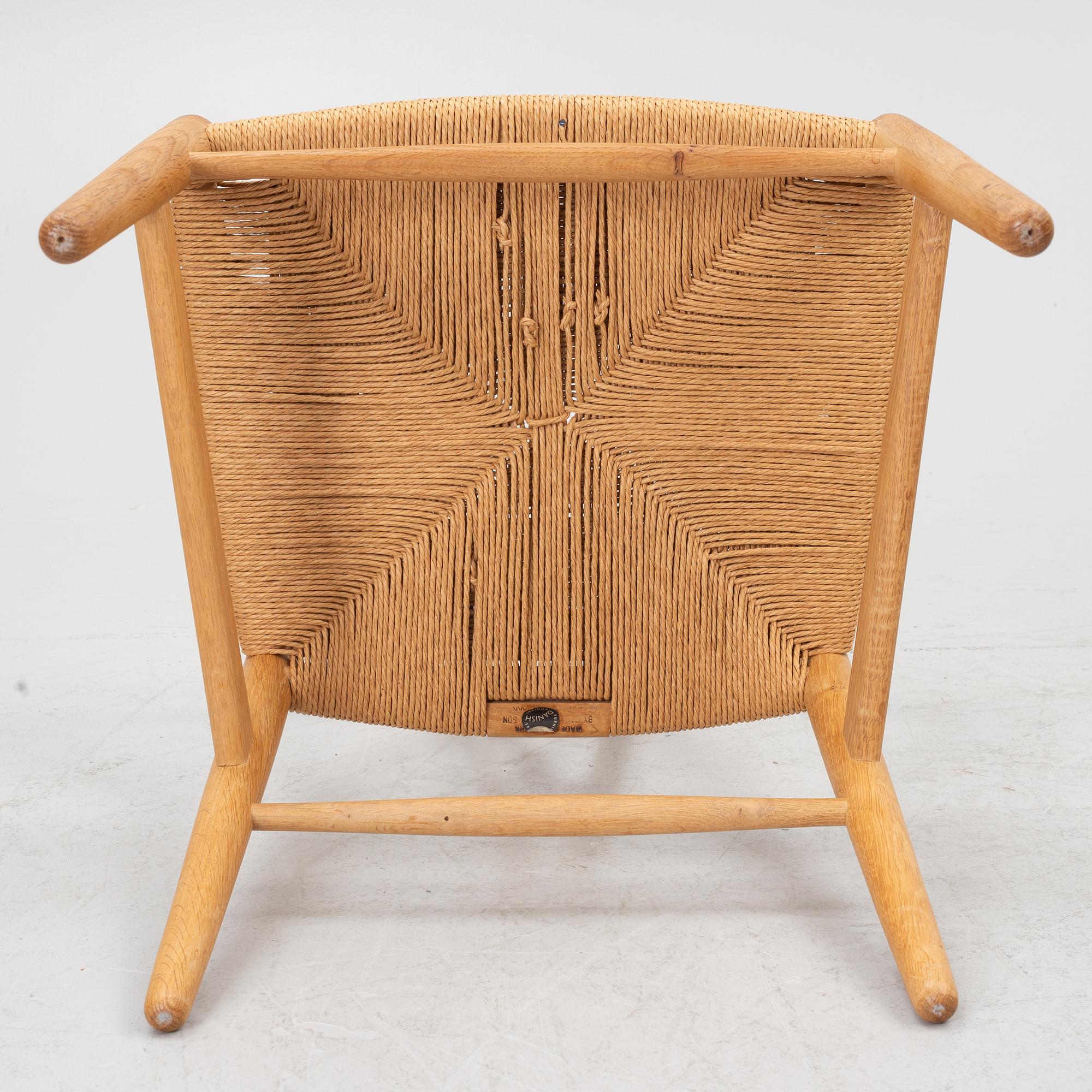 Hans J. Wegner, four model CH-24/ 'Wishbone' chairs, Carl Hansen, Odense, Denmark, second half of the 20th century.