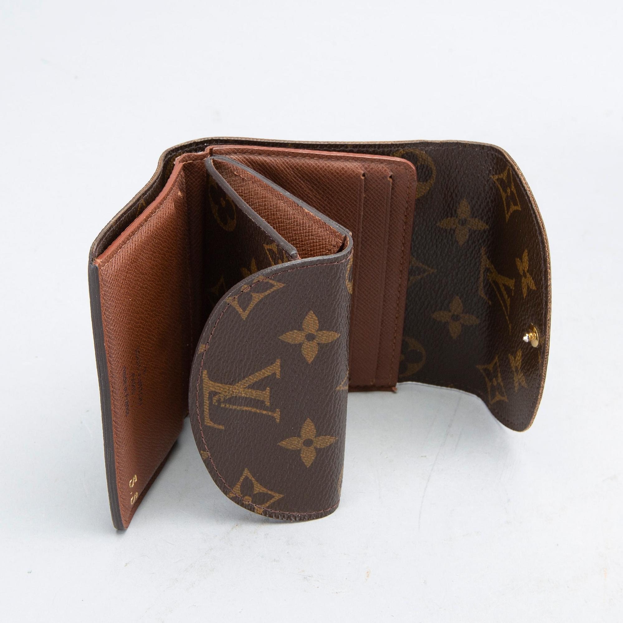 An 'Helene' wallet by Louis Vuitton.