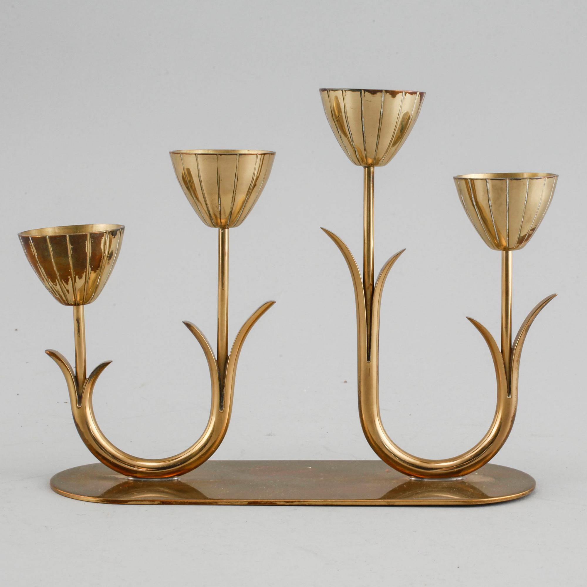 A candelabrum and one camdelstick by Gunnar Ander for Ystad Metall, 20th century.