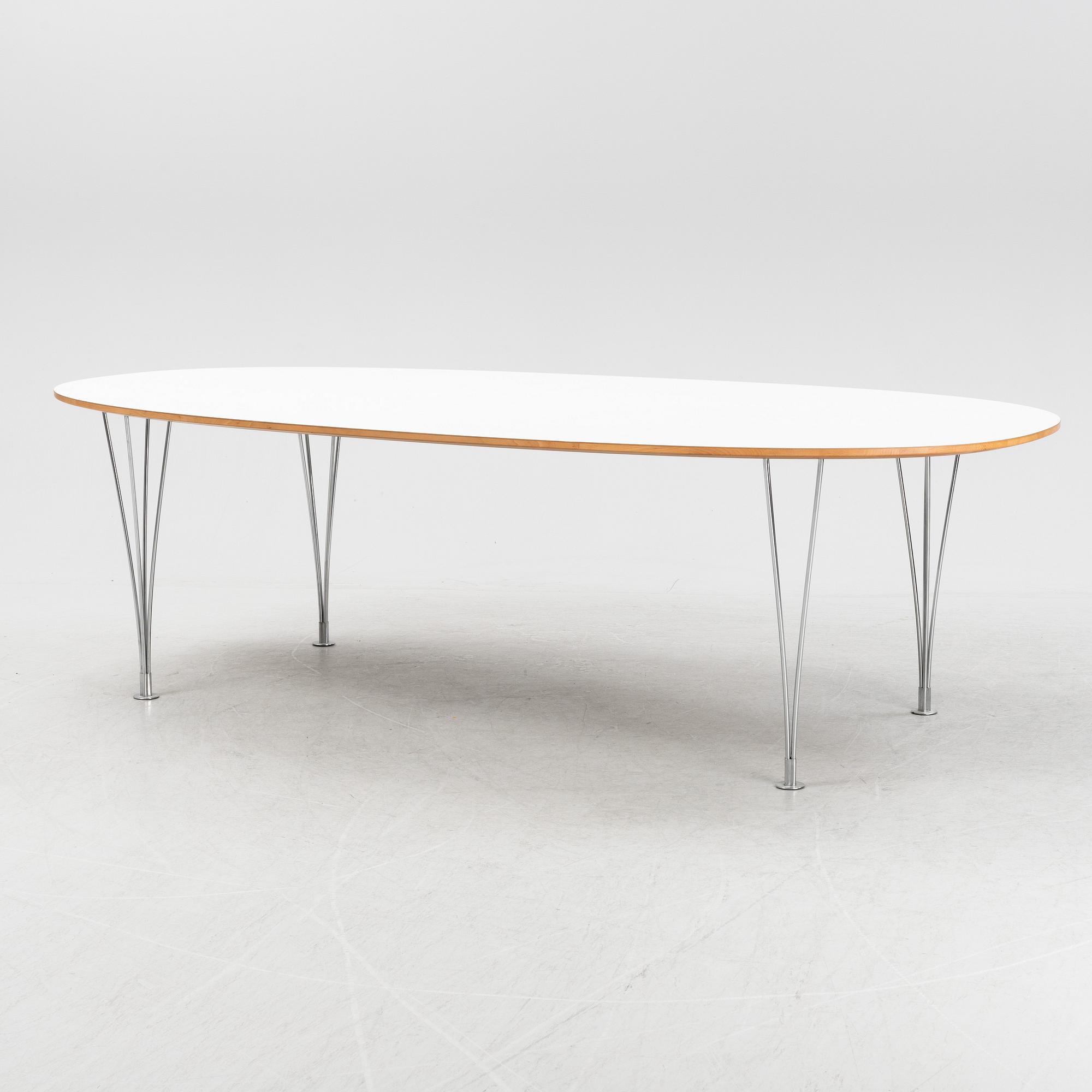 A Super ellpitical dining table, by Bruno Mathsson and Piet Hein for Fritz Hansen dated 2008.