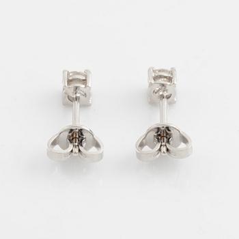 Brilliant cut diamond stud earrings.
