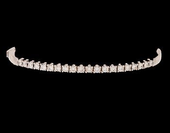 An 18K white gold bracelet set with round brilliant-cut diamonds.