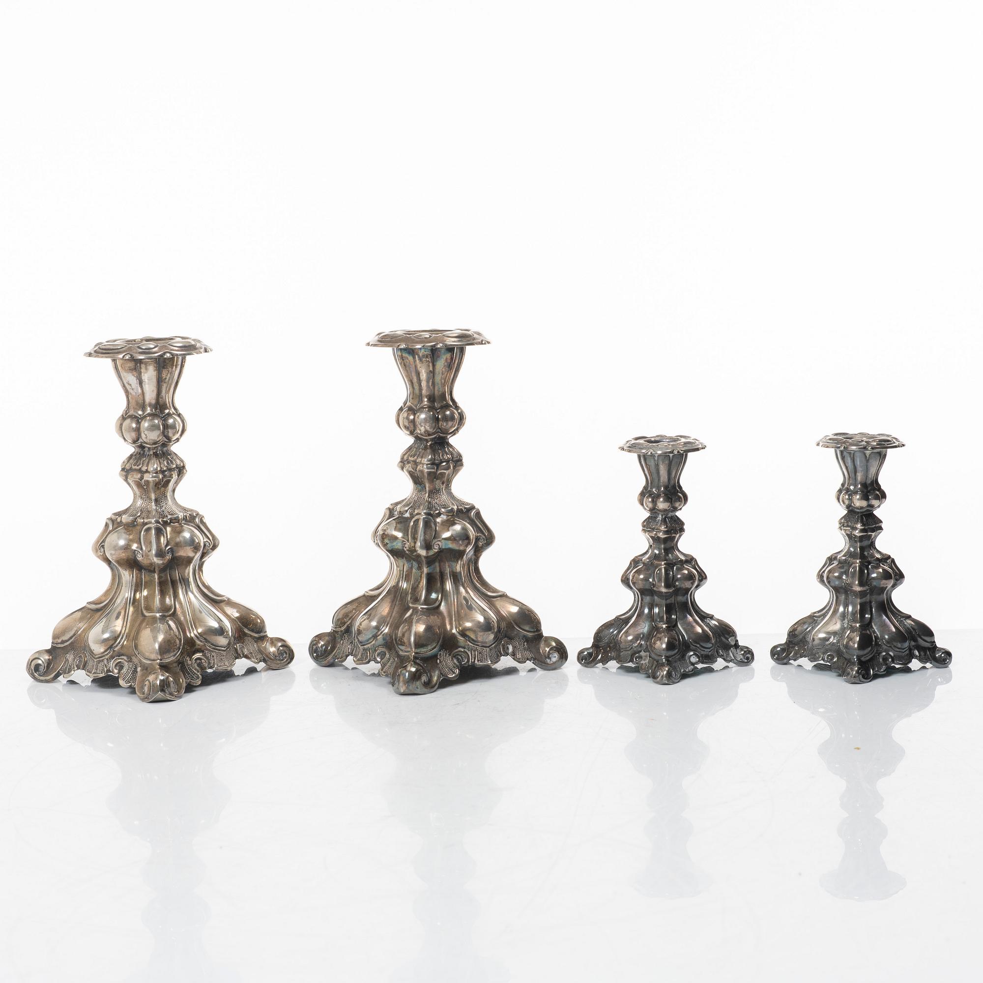 Four Baroque style silver candlesticks, 20th century.