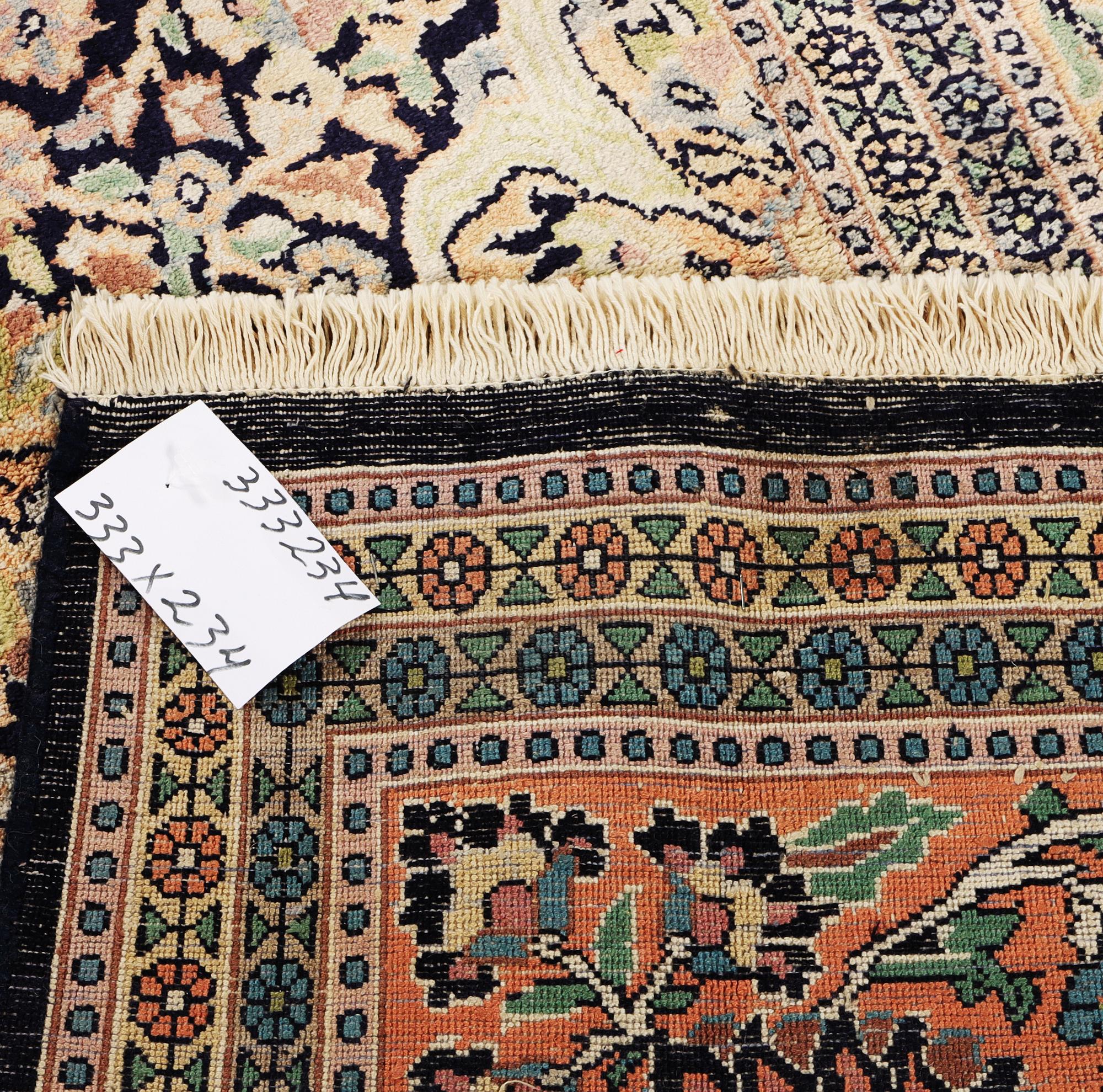 A Kashmir carpet, silk, c. 333 x 234 cm.