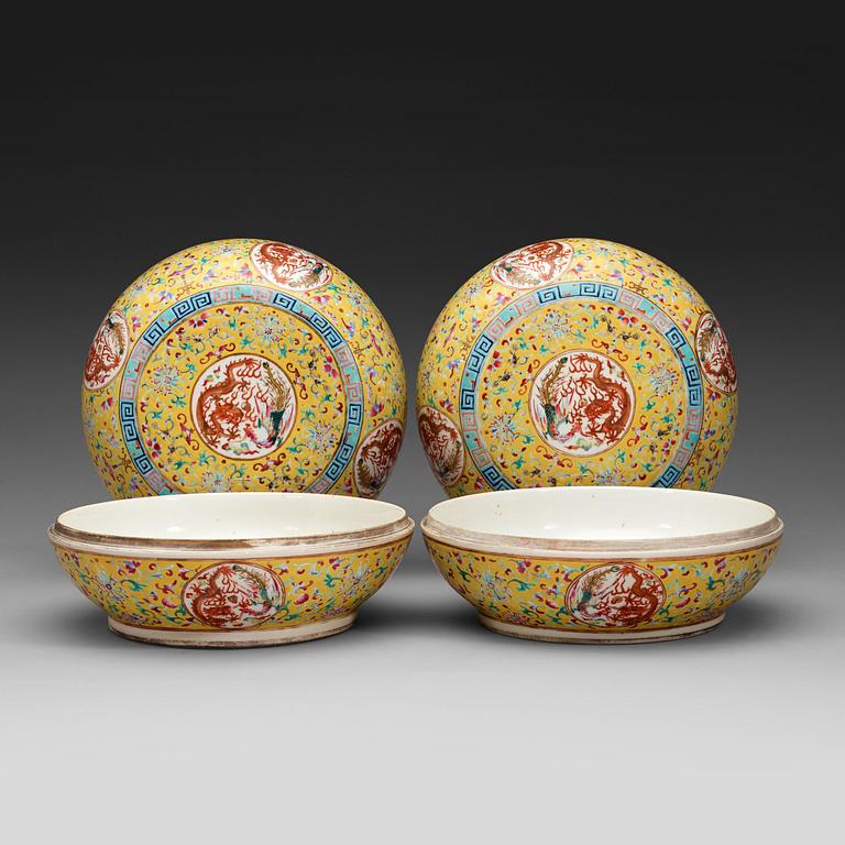 A pair of circular yellow ground and famille rose 'dragon' boxes with covers,  late Qing dynasty.