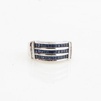 Ring, 18K white gold with baguette-cut diamonds and princess-cut sapphires.