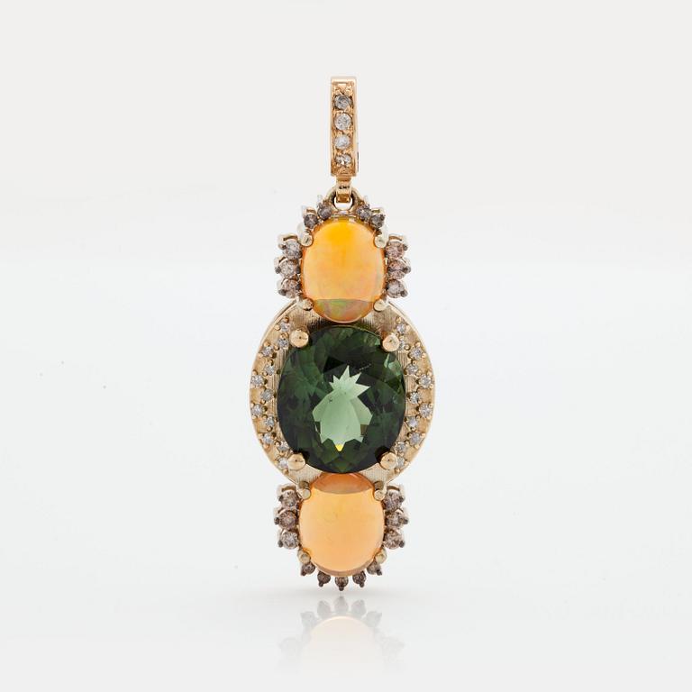 A PENDANT set with a green tourmaline and opals.