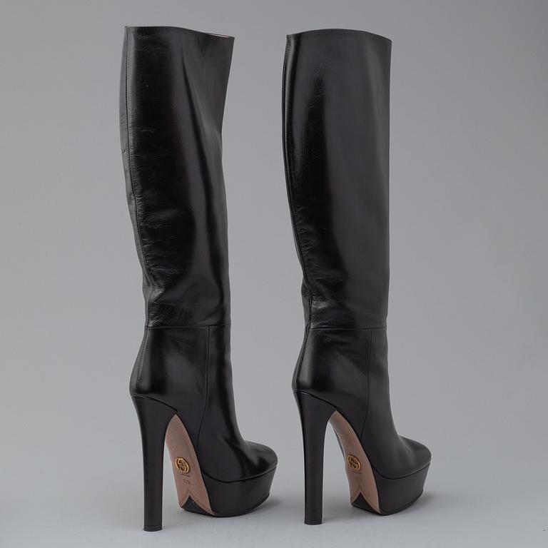 GUCCI, a pair of platform, high heel leather boots, size 37½.
