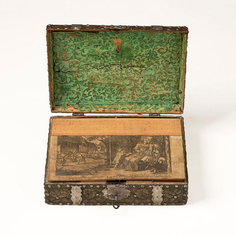 A presumably German baroque repoussé brass writing box, late 17th century.