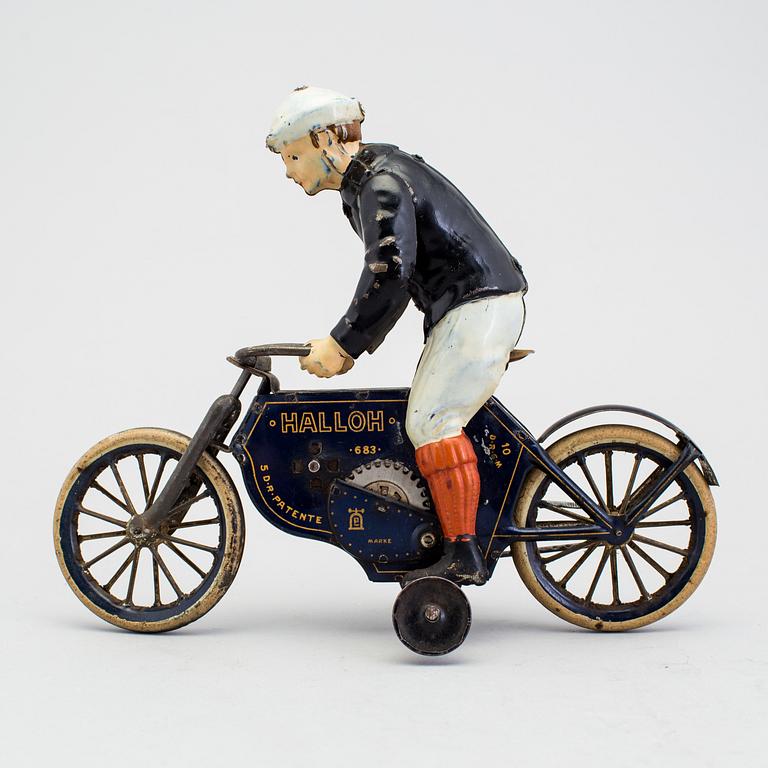 A partially hand painted tinplate Lehmann Halloh motorcycle, Germany. In production 1914-41.