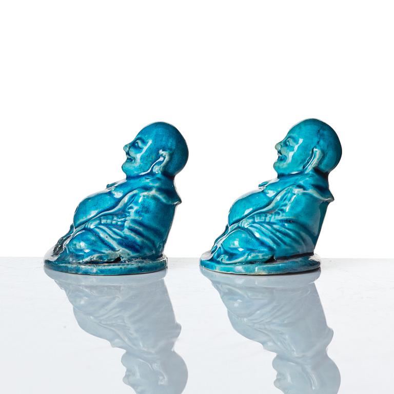 A pair of turquoise glazed joss stick holders in the shape of Buddai, Qing dynasty, 18th Century.