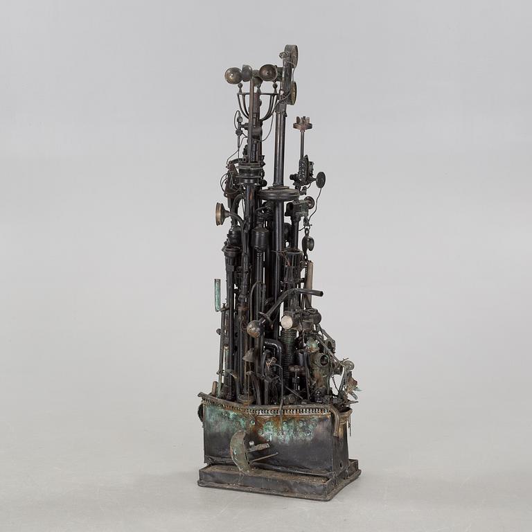 a metal sculpture, signed.