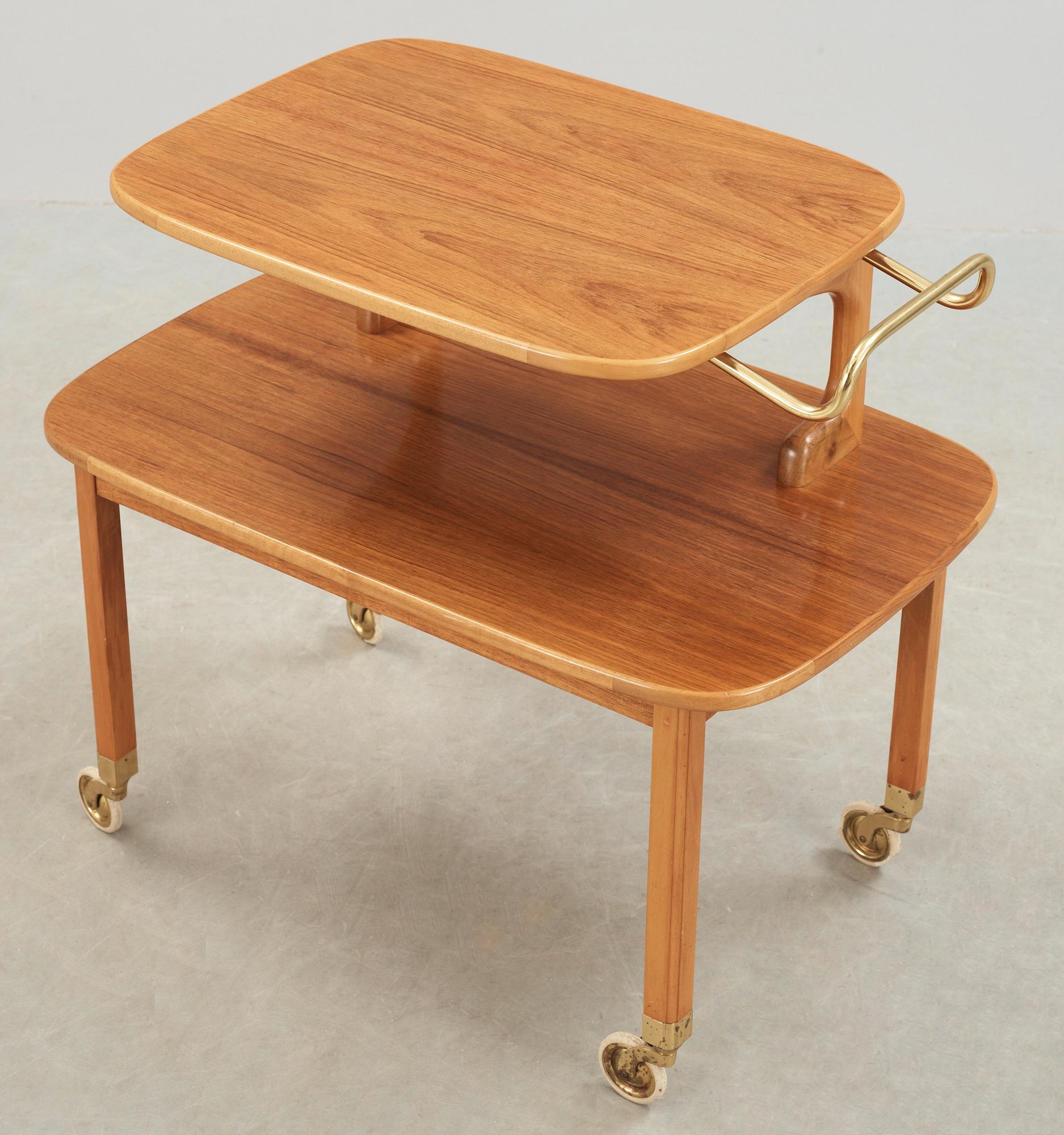A Josef Frank walnut and mahogany serving trolley, Svenskt Tenn, probably 1950's.