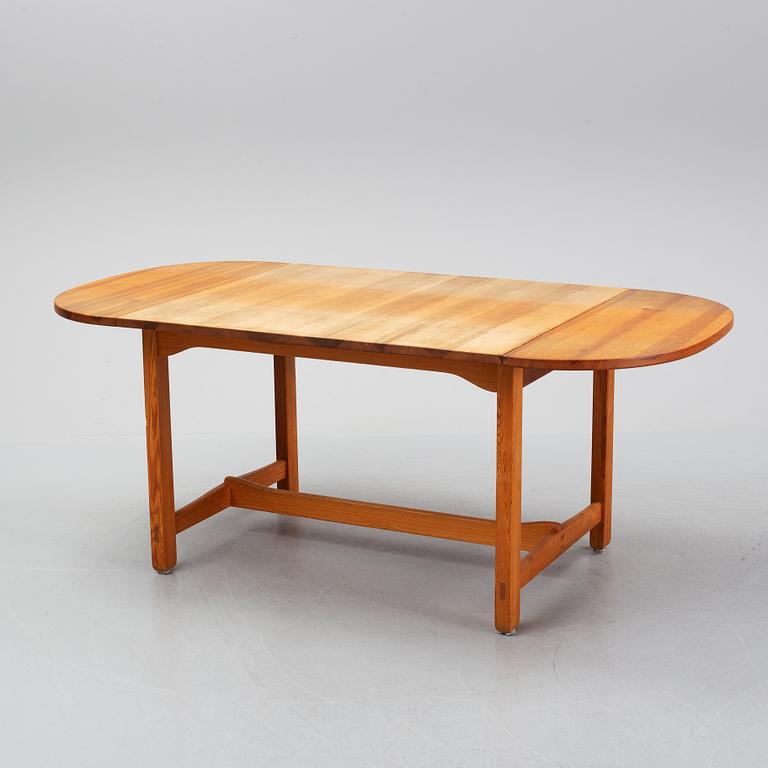 Carl Malmsten, a pine dining table and 6 chairs.