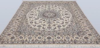 A Nain part silk carpet, 269 x 213 cm.