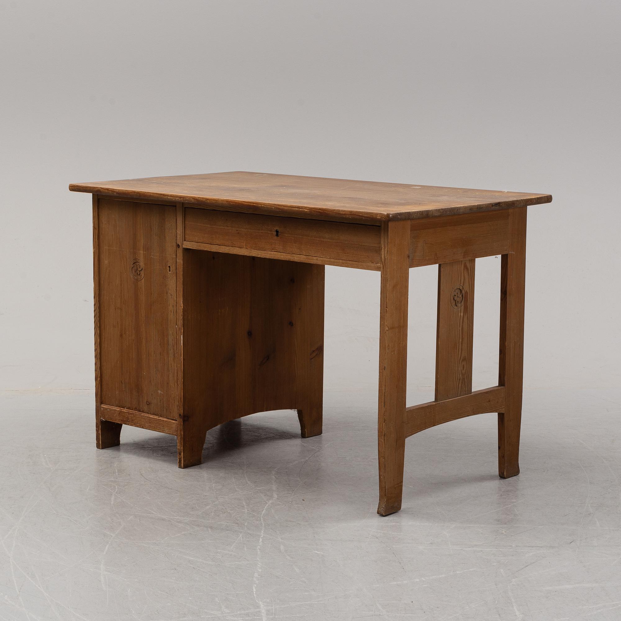 A stained pine writing desk attributed to Carl Westman, early 20th Century.