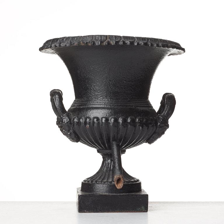 A Louis XVI-style garden urn, circa 1900.