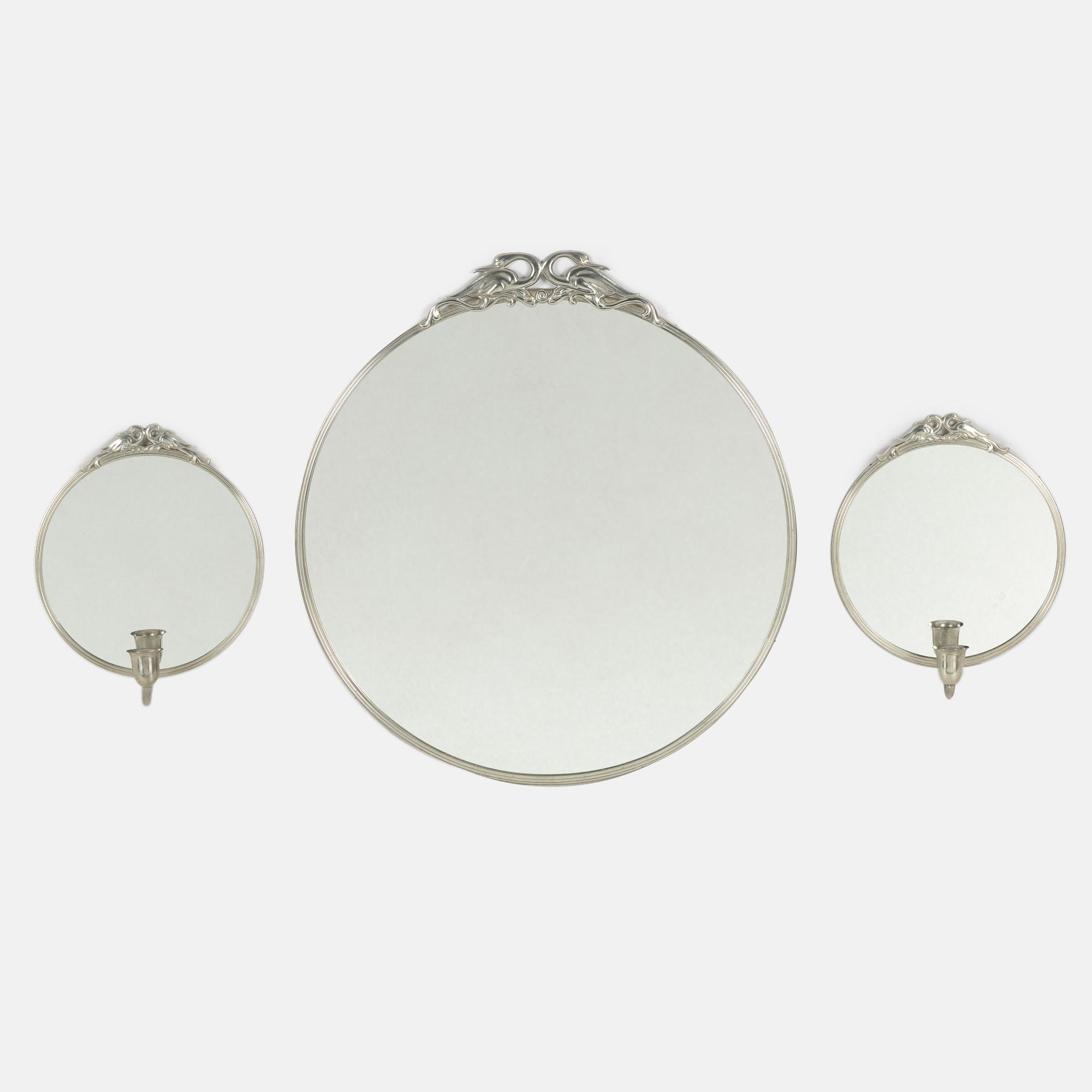 A pewter mirror and a pair of mirror sconces,  second quarter of the 20th century.