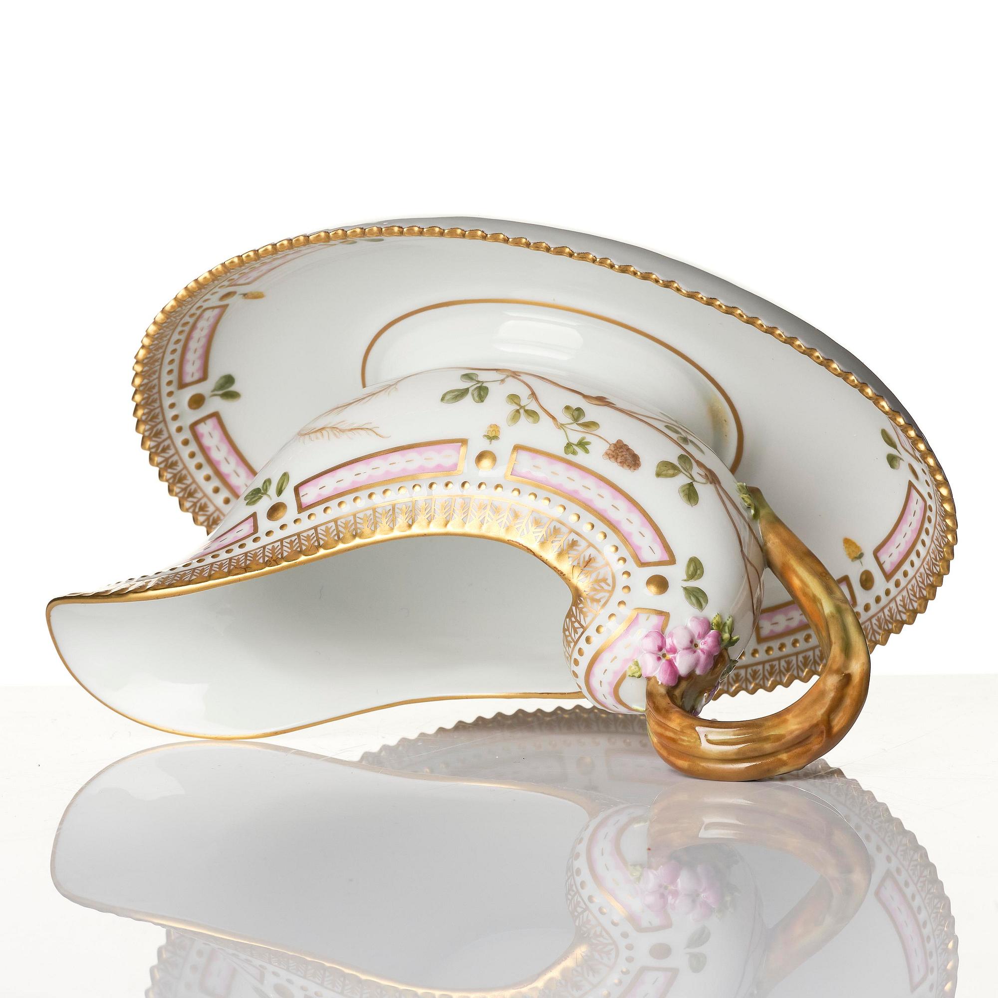 A Royal Copenhagen 'Flora Danica' sauce boat and a pillow shaped bowl, Denmark, 20th century.