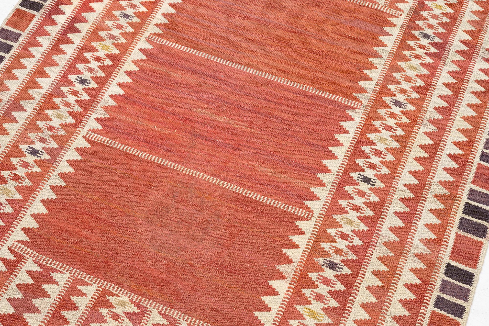 Barbro Nilsson, a carpet, 'Salerno röd', flat weave, c. 214 x 158 cm, signed AB MMF BN.
