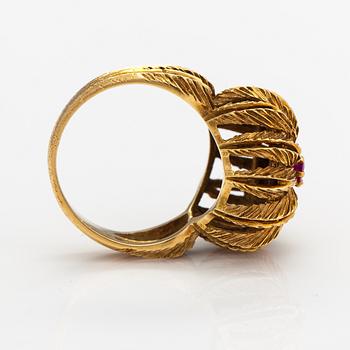 An 18K gold ring with a ruby.