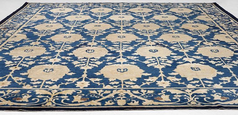 An antique Peking carpet, north China, c. 438 x 373 cm.