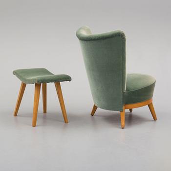 a mid 50th century easy chair with stool.