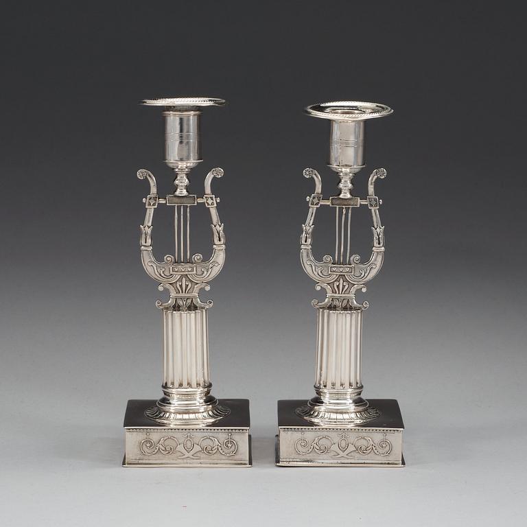 A pair of Swedish 19th century silver candlesticks, makers mark of Johan Petter Grönvall, Stockholm 1823.