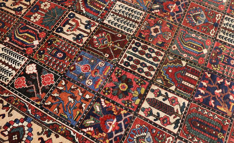 A semi-antique Baktiari carpet, approx. 360 x 308 cm.