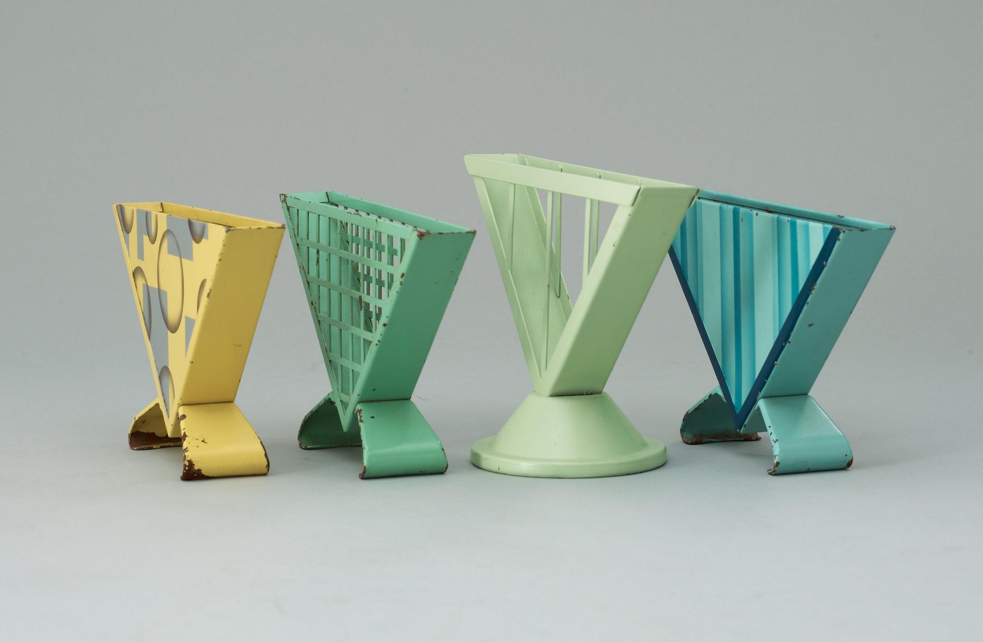 A set of four Marianne Brandt enameled metal napkin holders, Ruppelwerk Metallwarenfabrik, Gotha, Germany circa 1930-32.